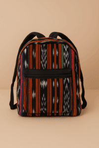Handwoven Guatemalan backpack in black and orange ikat
